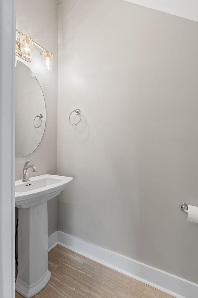 1512 Dr D B Todd Jr Blvd, Nashville, TN 37208 - bathroom featuring baseboards, wood finished floors, and a sink