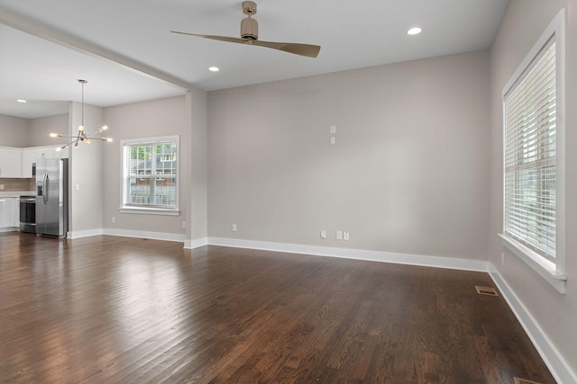 1512 Dr D B Todd Jr Blvd, Nashville, TN 37208 - unfurnished living room featuring dark wood finished floors, a chandelier, a ceiling fan, baseboards, and recessed lighting