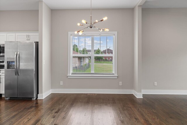 1512 Dr D B Todd Jr Blvd, Nashville, TN 37208 - unfurnished dining area featuring a chandelier, dark wood-style flooring, and baseboards