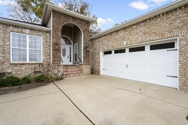 2240 Killington Dr, Clarksville, TN 37040 - entrance to property featuring brick siding, concrete driveway, and an attached garage