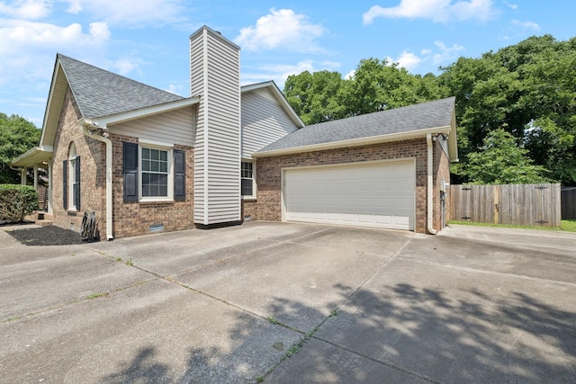 2118 Winthorne Ln, Murfreesboro, TN 37129 - view of front facade featuring brick siding, driveway, a shingled roof, an attached garage, and a chimney