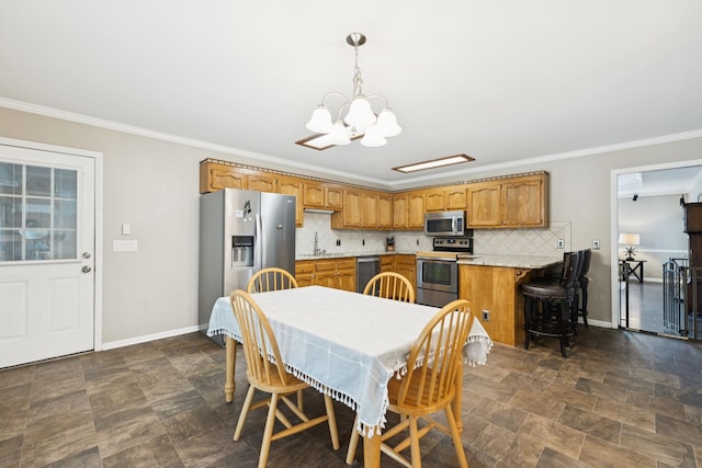 2118 Winthorne Ln, Murfreesboro, TN 37129 - dining space with a chandelier, crown molding, baseboards, and stone finish floors