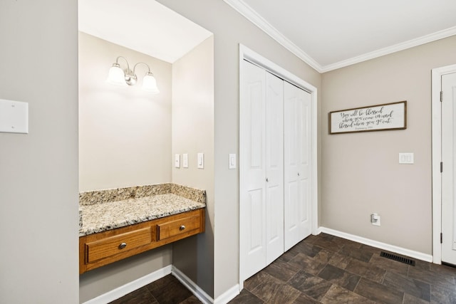 2118 Winthorne Ln, Murfreesboro, TN 37129 - mudroom with ornamental molding, baseboards, and dark stone finish floors