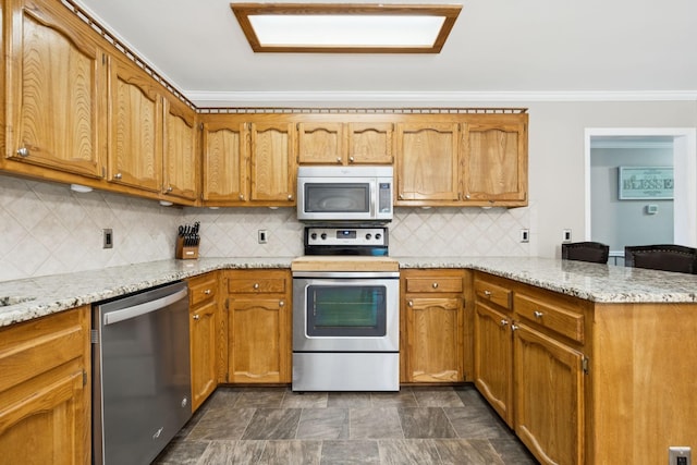 2118 Winthorne Ln, Murfreesboro, TN 37129 - kitchen with appliances with stainless steel finishes, a peninsula, crown molding, decorative backsplash, and brown cabinetry