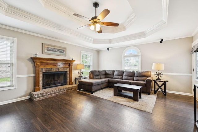 2118 Winthorne Ln, Murfreesboro, TN 37129 - living area featuring crown molding, wood-type flooring, a ceiling fan, a tray ceiling, and a brick fireplace