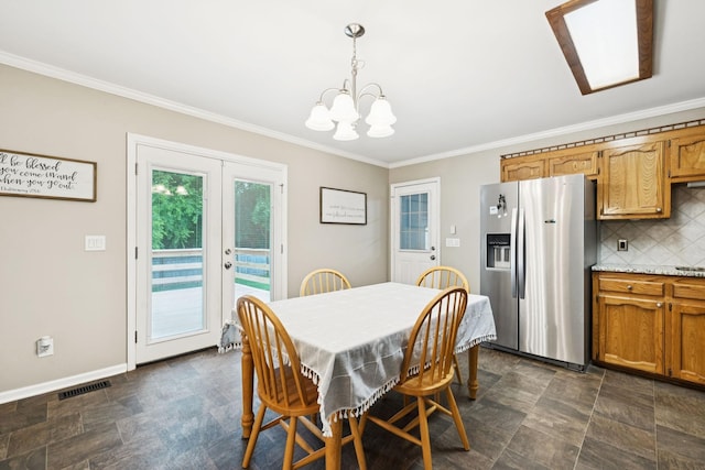 2118 Winthorne Ln, Murfreesboro, TN 37129 - dining room with ornamental molding, french doors, stone finish floors, a chandelier, and baseboards