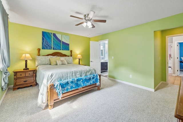 2416 Ravine Dr, Nashville, TN 37217 - carpeted bedroom with baseboards, connected bathroom, ceiling fan, and a textured ceiling