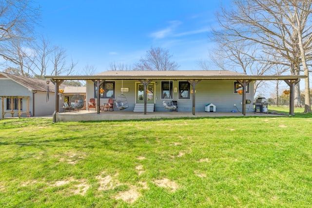 98 Breeden Rd, New Johnsonville, TN 37134 - back of house featuring a yard