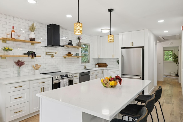 170 Old Carters Creek Pike, Franklin, TN 37064 - kitchen with appliances with stainless steel finishes, range hood, a sink, open shelves, and a breakfast bar area