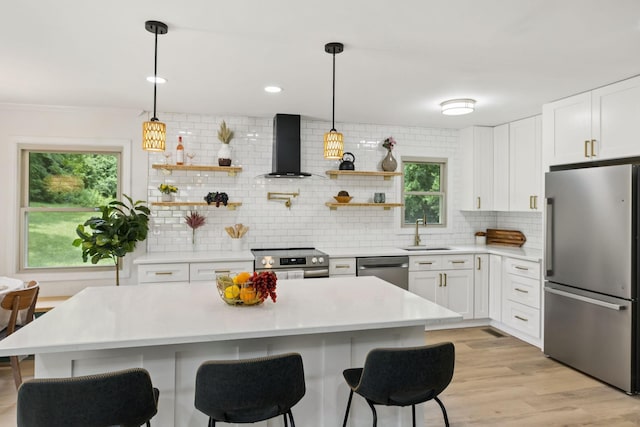 170 Old Carters Creek Pike, Franklin, TN 37064 - kitchen with appliances with stainless steel finishes, wall chimney range hood, a sink, tasteful backsplash, and light countertops