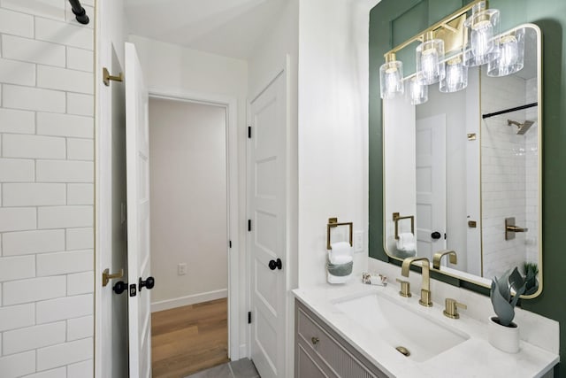 170 Old Carters Creek Pike, Franklin, TN 37064 - full bath with vanity, wood finished floors, baseboards, and a tile shower