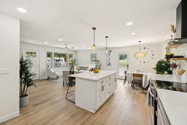 170 Old Carters Creek Pike, Franklin, TN 37064 - kitchen featuring stainless steel range with electric stovetop, light countertops, healthy amount of natural light, white cabinetry, and recessed lighting