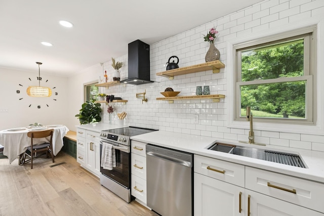 170 Old Carters Creek Pike, Franklin, TN 37064 - kitchen with stainless steel appliances, wall chimney exhaust hood, light countertops, tasteful backsplash, and recessed lighting