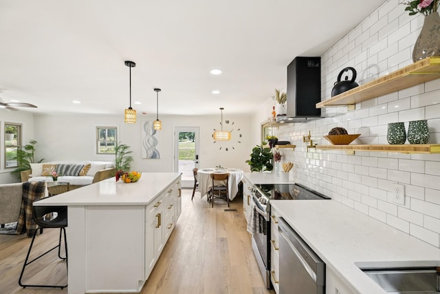 170 Old Carters Creek Pike, Franklin, TN 37064 - kitchen featuring open shelves, extractor fan, light countertops, appliances with stainless steel finishes, and open floor plan