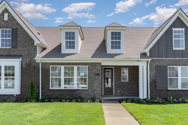 1079 Wrights Mill Rd Unit H8, Spring Hill, TN 37174 - view of front of home with brick siding, a front yard, and board and batten siding