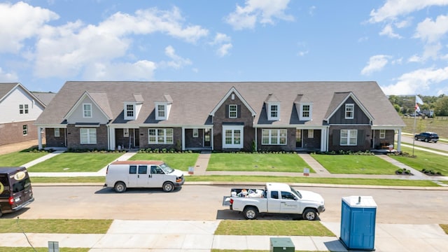 1079 Wrights Mill Rd Unit H8, Spring Hill, TN 37174 - view of front facade with a front lawn, uncovered parking, and brick siding