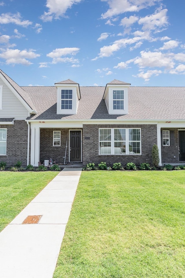 1079 Wrights Mill Rd Unit H8, Spring Hill, TN 37174 - view of front of home featuring brick siding and a front lawn