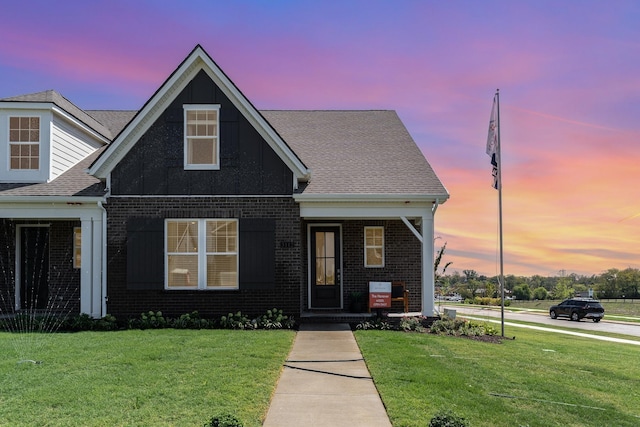 1079 Wrights Mill Rd Unit H8, Spring Hill, TN 37174 - view of front facade featuring a front yard, brick siding, board and batten siding, and a shingled roof