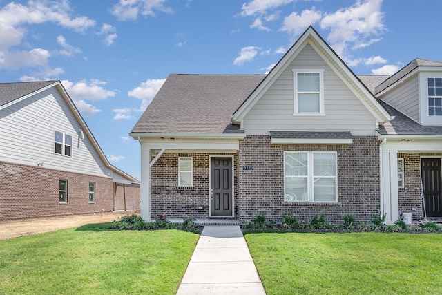 1079 Wrights Mill Rd Unit H8, Spring Hill, TN 37174 - view of front facade featuring brick siding, a front yard, and roof with shingles