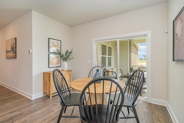 1079 Wrights Mill Rd Unit H8, Spring Hill, TN 37174 - dining space with dark wood-style flooring and baseboards