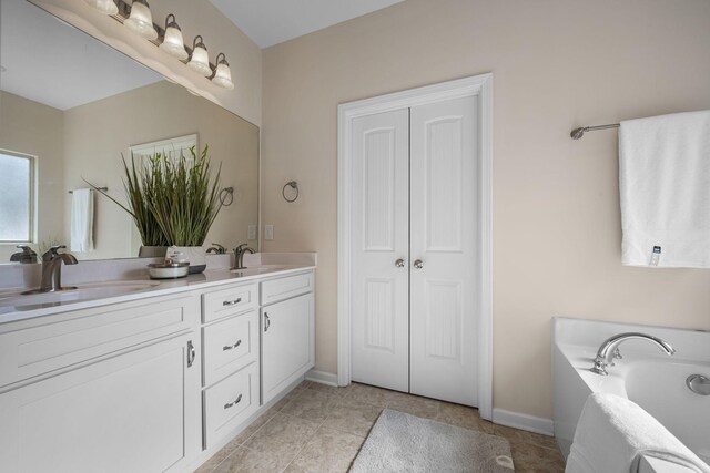 7504 Beechnut Way, Fairview, TN 37062 - full bathroom with double vanity, a bath, and baseboards