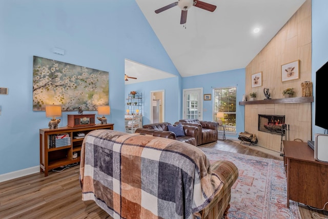 306 S Cameron Ct, Hermitage, TN 37076 - living room featuring a ceiling fan, high vaulted ceiling, a fireplace, wood finished floors, and baseboards