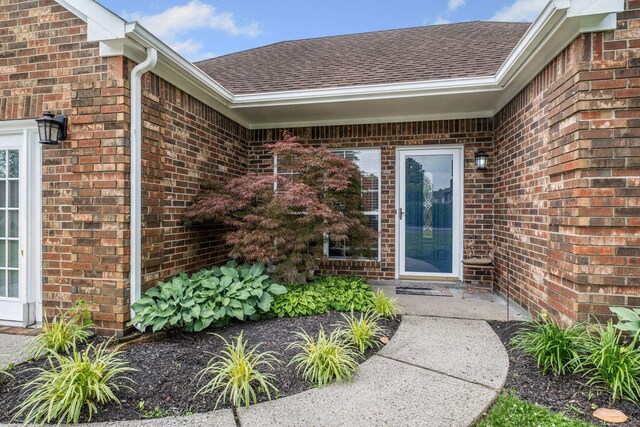 306 S Cameron Ct, Hermitage, TN 37076 - property entrance with roof with shingles and brick siding