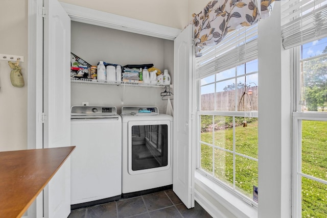 306 S Cameron Ct, Hermitage, TN 37076 - laundry area with washer and clothes dryer, healthy amount of natural light, and dark stone finish flooring