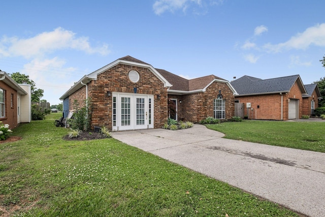 306 S Cameron Ct, Hermitage, TN 37076 - view of front facade featuring brick siding, a front yard, a shingled roof, and french doors