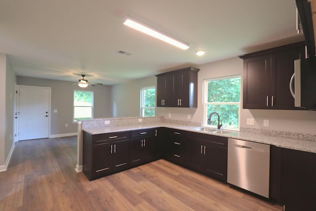 206 Sunset Dr, Red Boiling Springs, TN 37150 - kitchen with dishwasher, white microwave, a peninsula, wood finished floors, and a ceiling fan