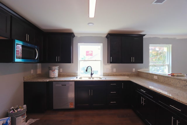 174 Dale St, Red Boiling Springs, TN 37150 - kitchen with appliances with stainless steel finishes, dark wood-type flooring, a sink, and dark cabinets