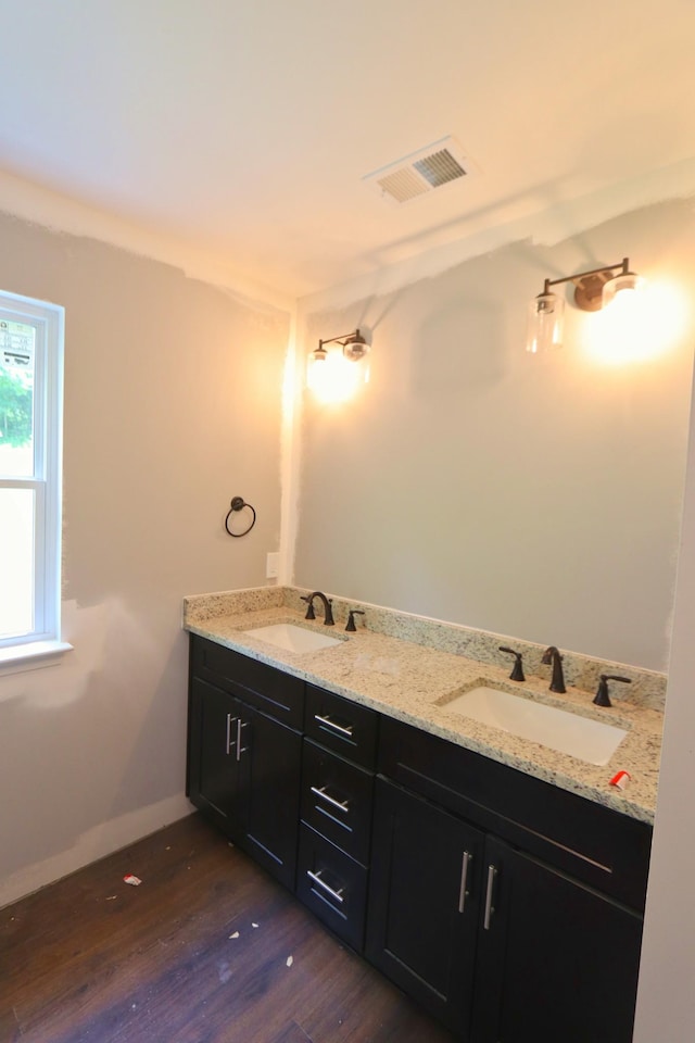 174 Dale St, Red Boiling Springs, TN 37150 - bathroom with double vanity, wood finished floors, and baseboards