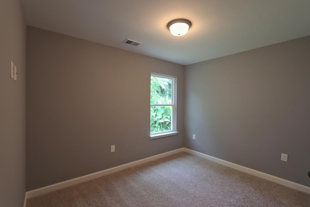174 Dale St, Red Boiling Springs, TN 37150 - carpeted empty room with baseboards