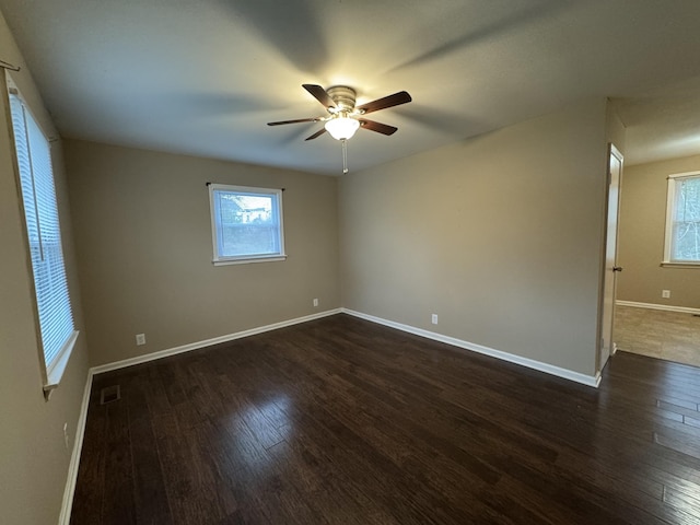 513 Adams Ct, Clarksville, TN 37040 - unfurnished room featuring dark wood finished floors, plenty of natural light, ceiling fan, and baseboards