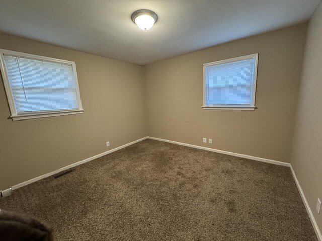513 Adams Ct, Clarksville, TN 37040 - unfurnished room featuring dark colored carpet and baseboards