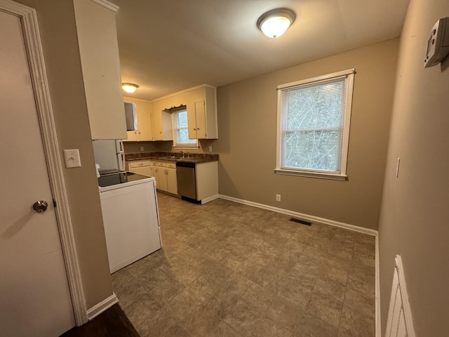 513 Adams Ct, Clarksville, TN 37040 - kitchen with dishwasher, washer / clothes dryer, white cabinetry, a wall mounted air conditioner, and dark countertops
