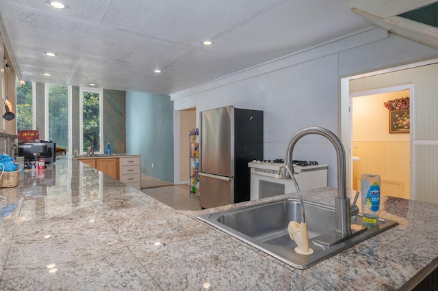 1791 Deer Creek Rd, Linden, TN 37096 - kitchen with freestanding refrigerator, tile counters, expansive windows, and recessed lighting