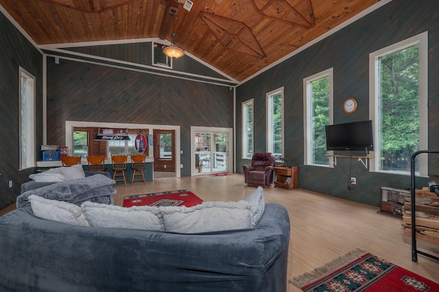 1791 Deer Creek Rd, Linden, TN 37096 - living room featuring a wooden ceiling with exposed beams, wood walls, wood finished floors, and high vaulted ceiling