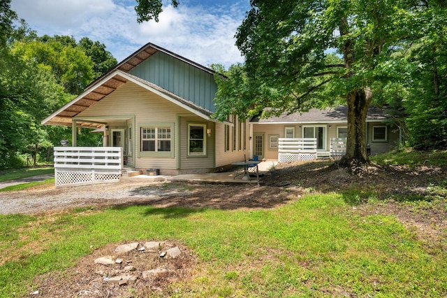 1791 Deer Creek Rd, Linden, TN 37096 - rear view of property featuring board and batten siding and a deck
