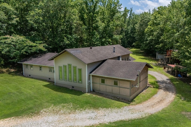 1791 Deer Creek Rd, Linden, TN 37096 - back of house featuring dirt driveway, roof with shingles, and a lawn