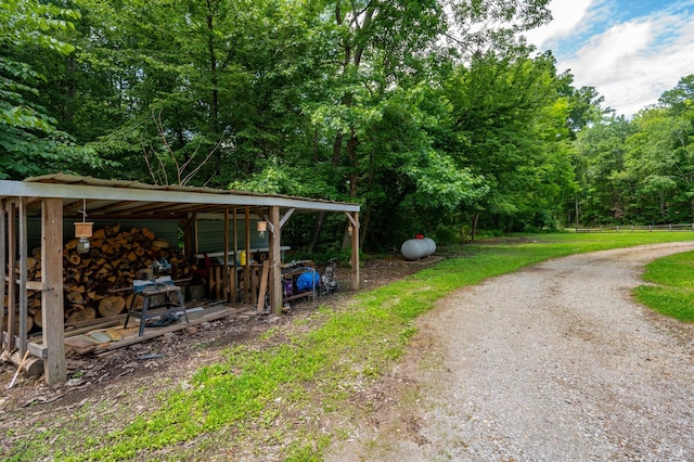 1791 Deer Creek Rd, Linden, TN 37096 - view of street featuring a forest view and an outbuilding