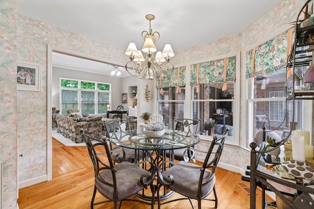 5544 S New Hope Rd, Hermitage, TN 37076 - dining space featuring wallpapered walls, a chandelier, wood finished floors, and baseboards