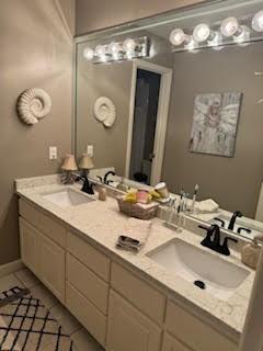 5544 S New Hope Rd, Hermitage, TN 37076 - full bathroom with double vanity and tile patterned floors