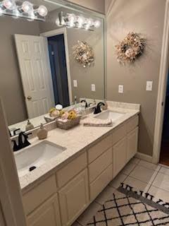 5544 S New Hope Rd, Hermitage, TN 37076 - bathroom with double vanity and tile patterned flooring