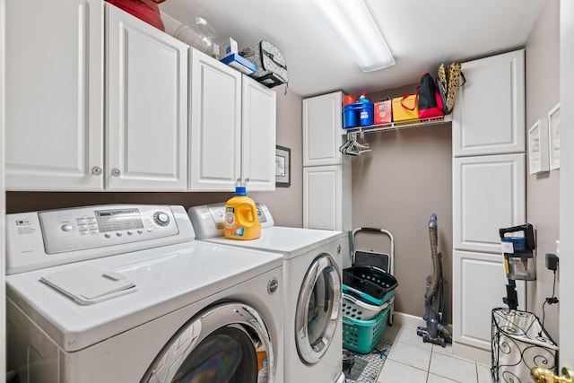 5544 S New Hope Rd, Hermitage, TN 37076 - laundry room with washer and clothes dryer, cabinet space, light tile patterned floors, and baseboards