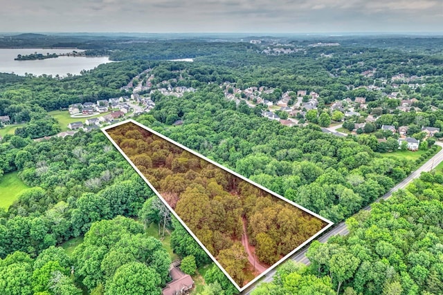 5544 S New Hope Rd, Hermitage, TN 37076 - aerial overview of property's location with a large body of water, property boundaries highlighted, and a heavily wooded area