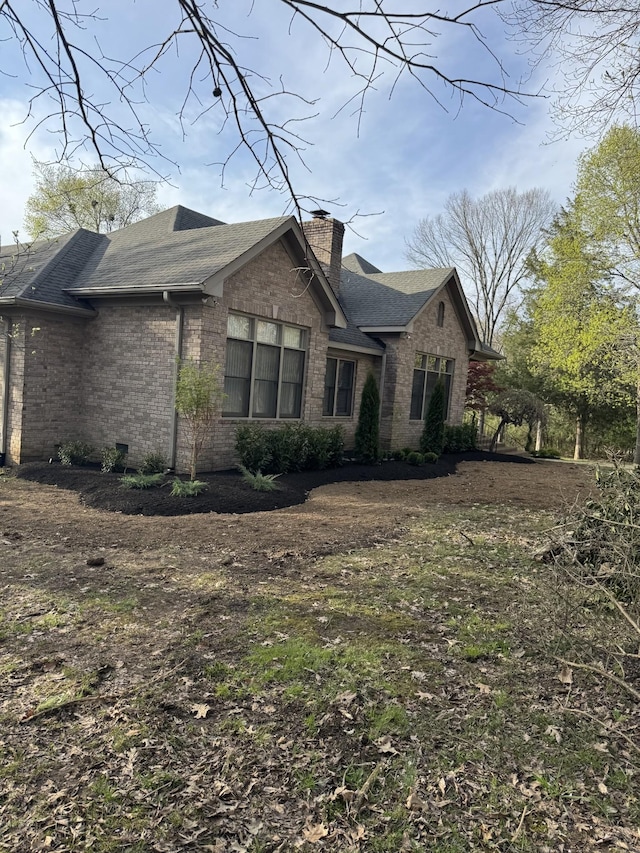 5544 S New Hope Rd, Hermitage, TN 37076 - view of side of property featuring brick siding, a chimney, and roof with shingles