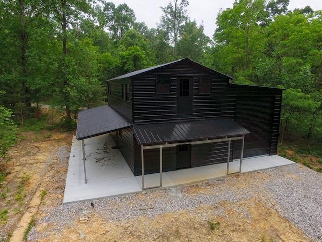 710 Baker Ter, Spencer, TN 38585 - rear view of property featuring metal roof and a patio area
