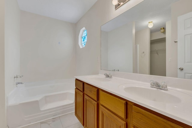 4008 Amber Way, Spring Hill, TN 37174 - full bathroom featuring a garden tub, double vanity, and a spacious closet