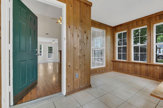 4008 Amber Way, Spring Hill, TN 37174 - unfurnished sunroom with wood walls, baseboards, and tile patterned floors
